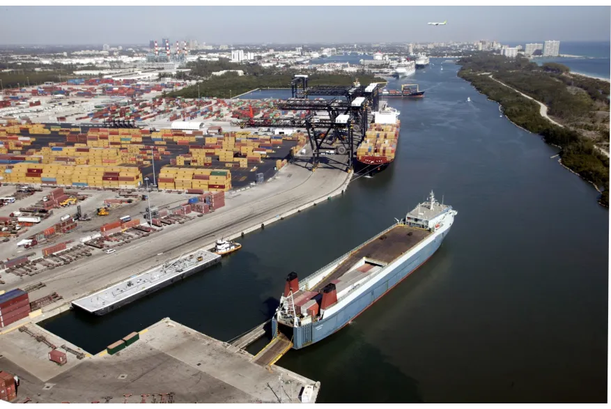 Aerial view of Port Everglades in Fort Lauderdale showing the tri-port layout — Southport container terminals, the cruise basin, and petroleum receiving operations coexisting inside a single harbor footprint.