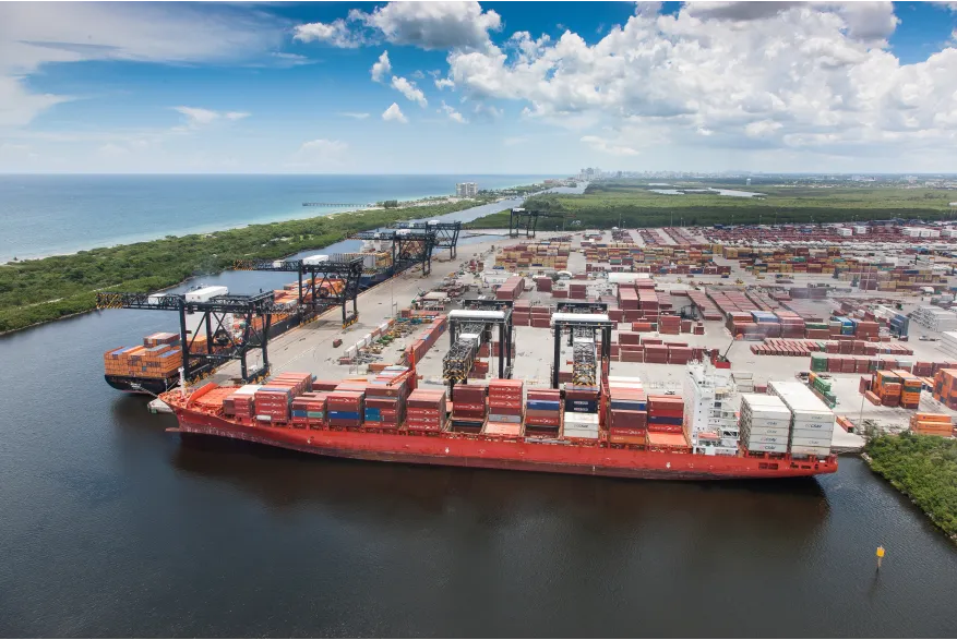 Port Everglades Southport — gantry cranes loading containers at the cargo terminals, with the Florida East Coast Railway near-dock intermodal facility and the Eller Drive approach nearby.