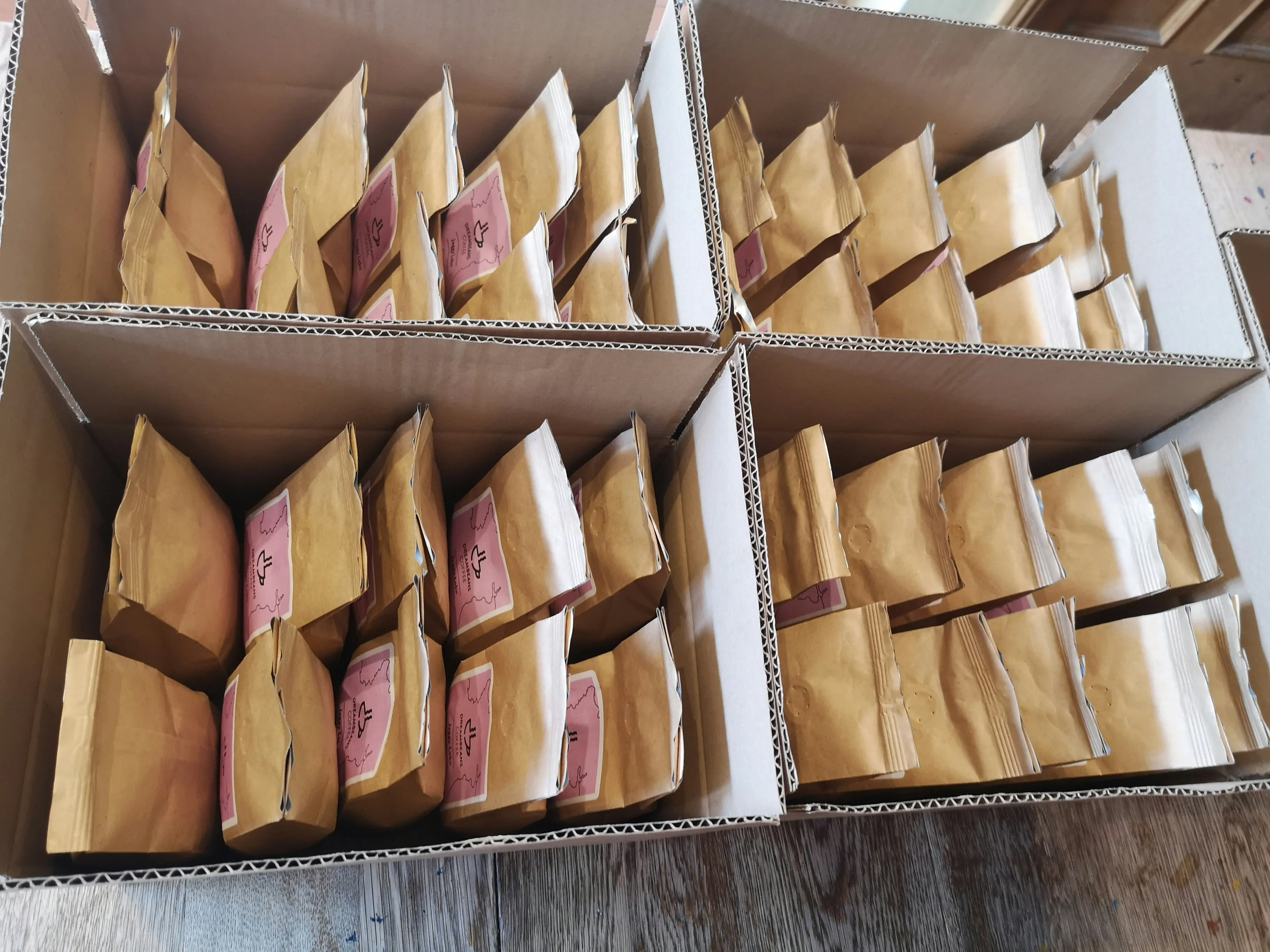 Order fulfillment in progress — inventory cycling through the pack line into outbound staging for the day’s carrier dispatches.