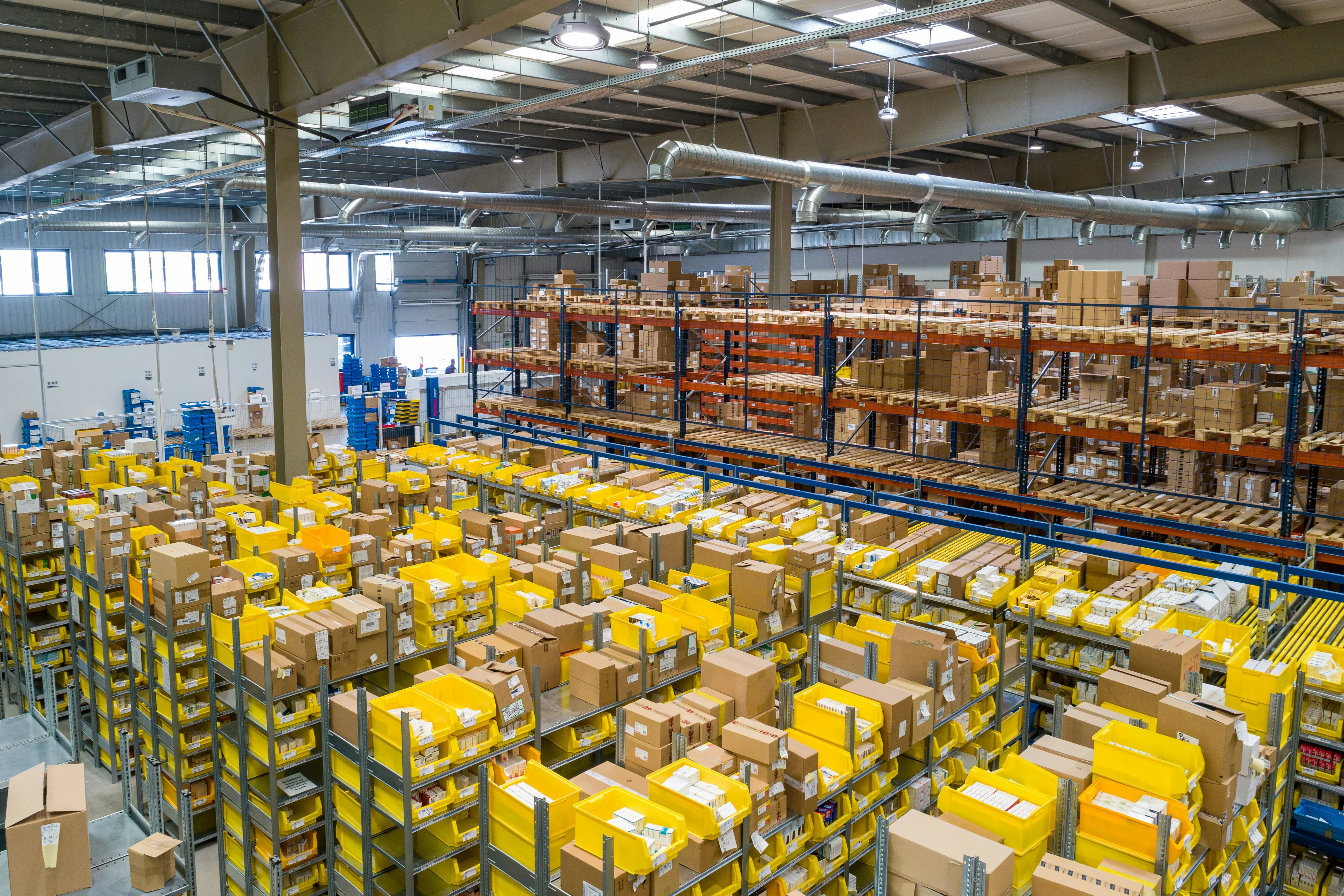 A fulfillment workstation in operation — inventory pulled to a pick station, packed for outbound, labeled and ready for the next carrier pickup window.
